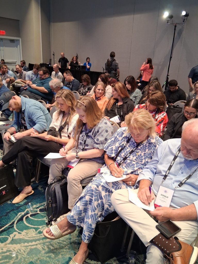 AtriumX conference activity encouraging attendees to answer three questions