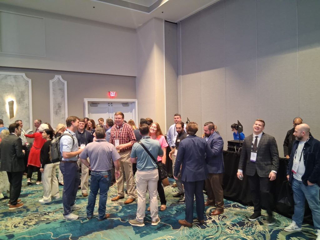AtriumX attendees forming discussion groups during the conference