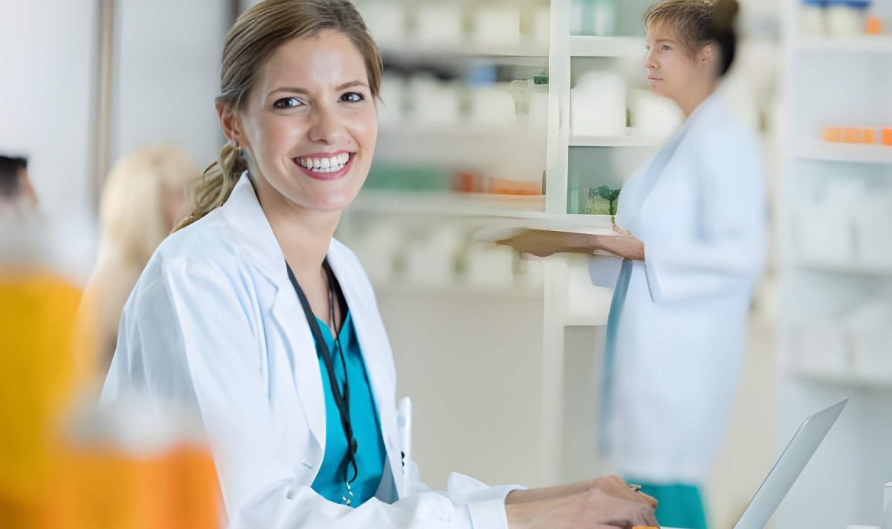 Smiling independent pharmacist at the counter